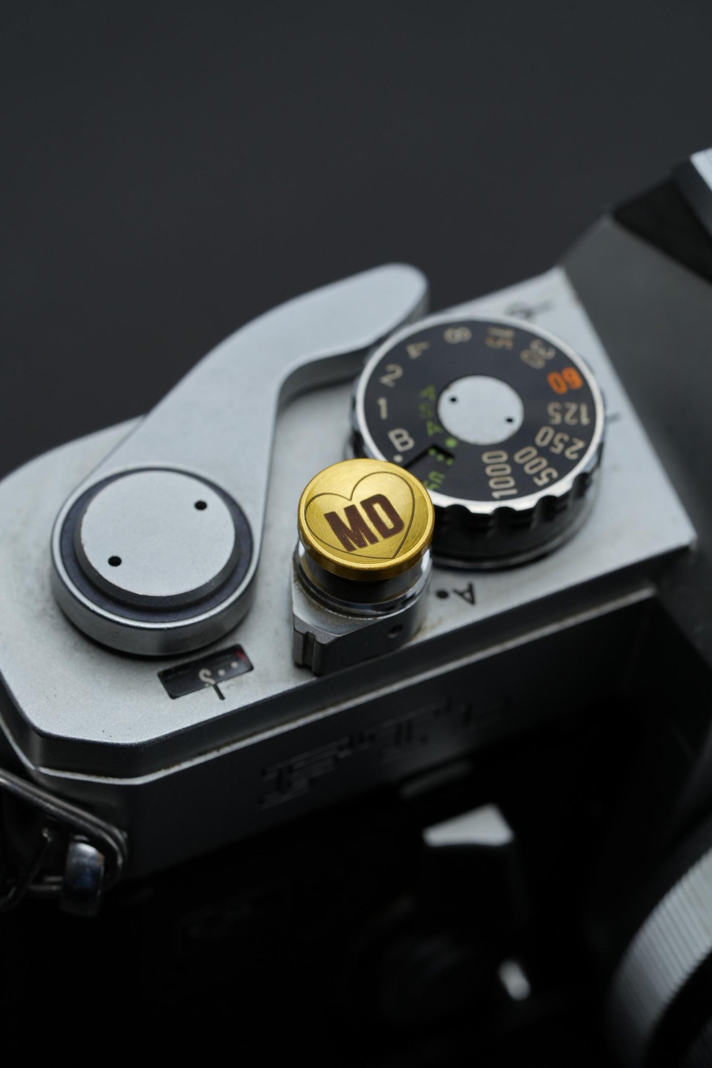 Laser gegraveerde ontspanknop voor jouw camera